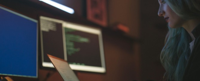 Free Side View of a Woman Using a Laptop Stock Photo