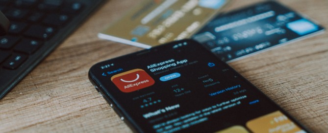 black and orange card on brown wooden table