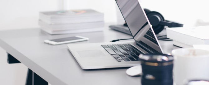 Free Gray Laptop on Table Top Stock Photo