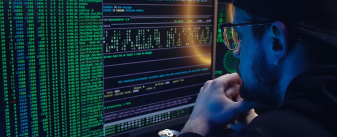 Free A Man Looking at a Computer Screen with Data Stock Photo