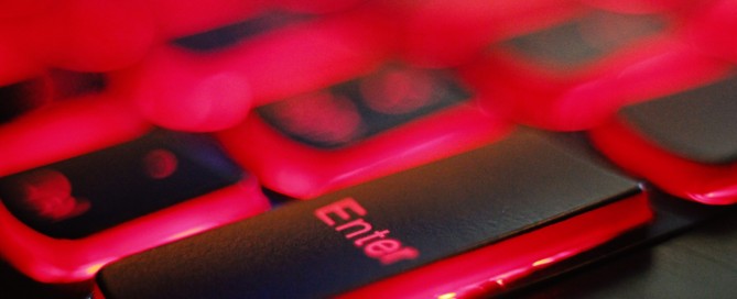 a close up of a red and black keyboard