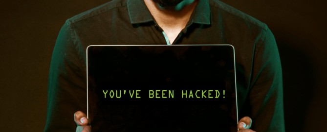 Free Man Holding Laptop Computer With Both Hands Stock Photo